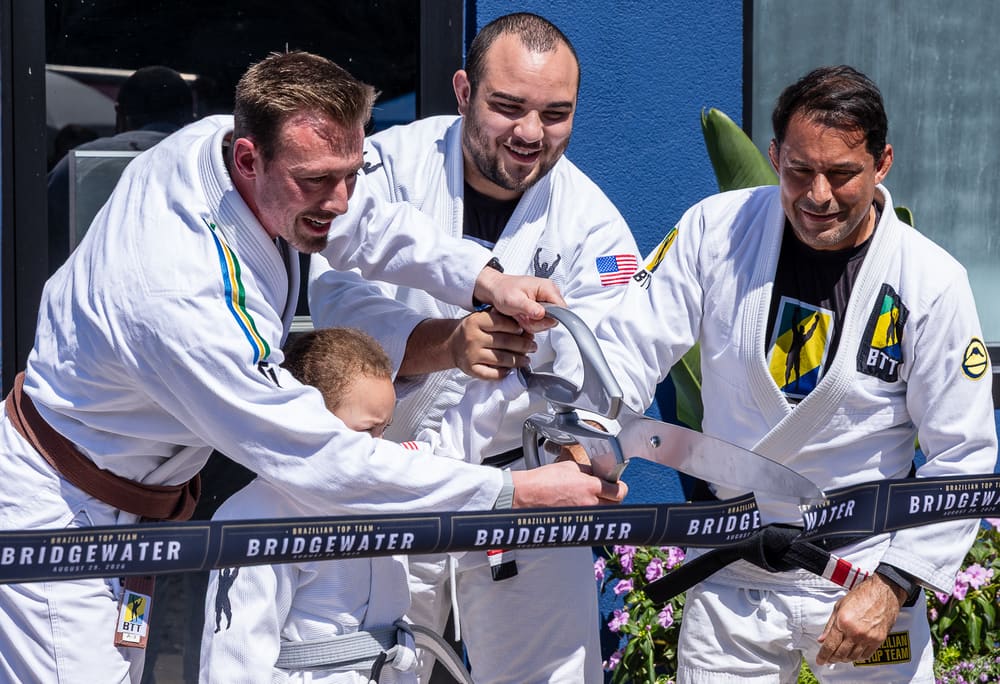 The BTT Bridgewater team cutting the ribbon outside the academy on opening day