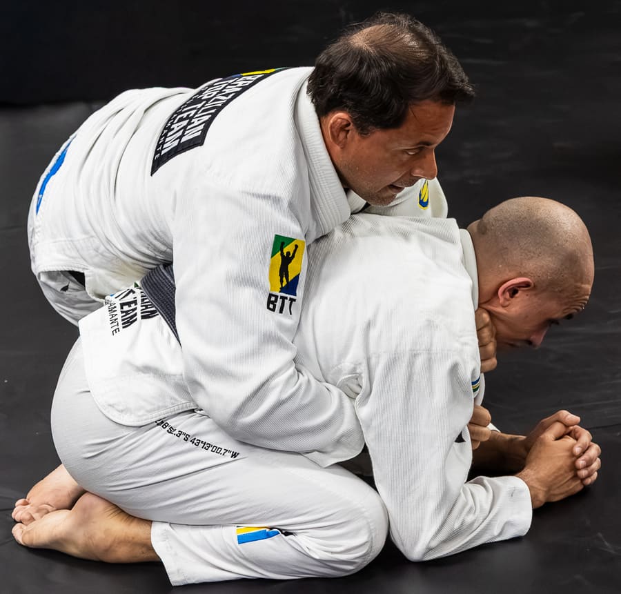 Two adults drilling a control position on the mats